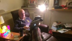 Photo of Nicholas Vince at work in his study