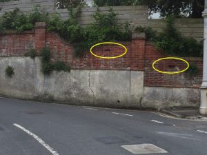 Image of Gunhole in wall at Meads Village