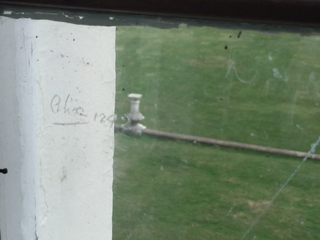 Image of Alexandra Hess's Name Carved In Window Pane at Compton Place